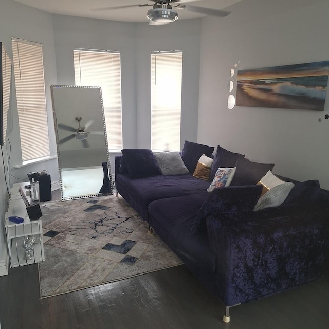 living room with wood finished floors and a ceiling fan