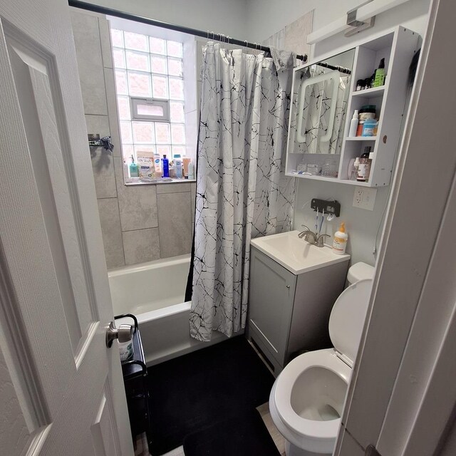 full bath with vanity, toilet, and shower / tub combo
