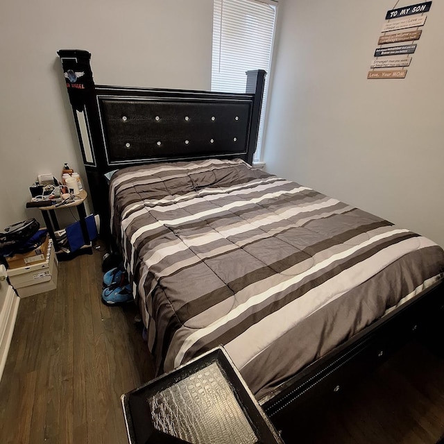 bedroom with wood finished floors