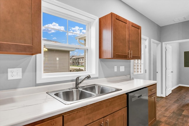 kitchen featuring dark hardwood / wood-style flooring, sink, and stainless steel dishwasher