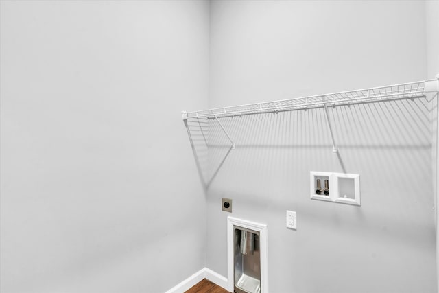 washroom featuring washer hookup, hardwood / wood-style flooring, and electric dryer hookup