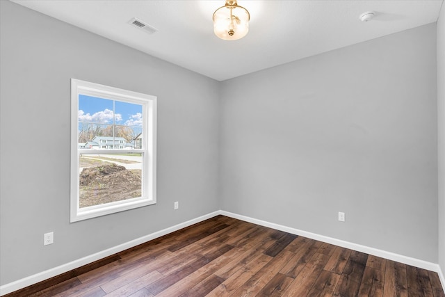 spare room featuring hardwood / wood-style flooring