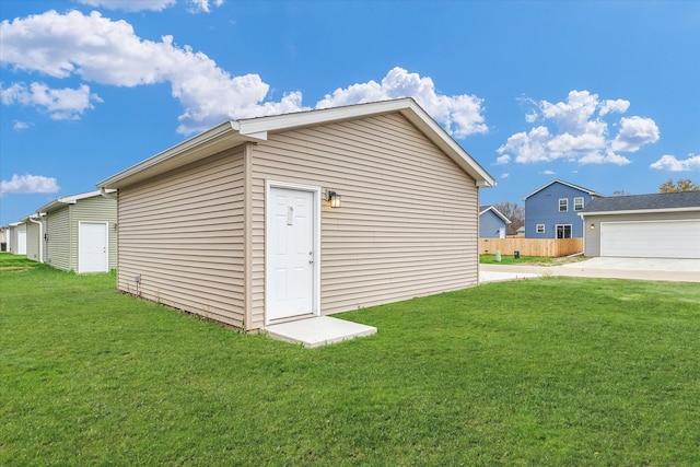 view of outbuilding featuring a yard