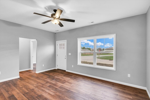 unfurnished room featuring dark hardwood / wood-style flooring and ceiling fan