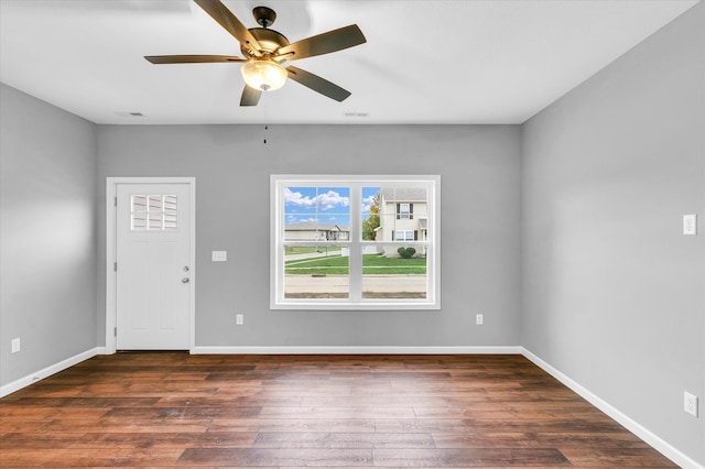 interior space featuring ceiling fan and dark wood-type flooring