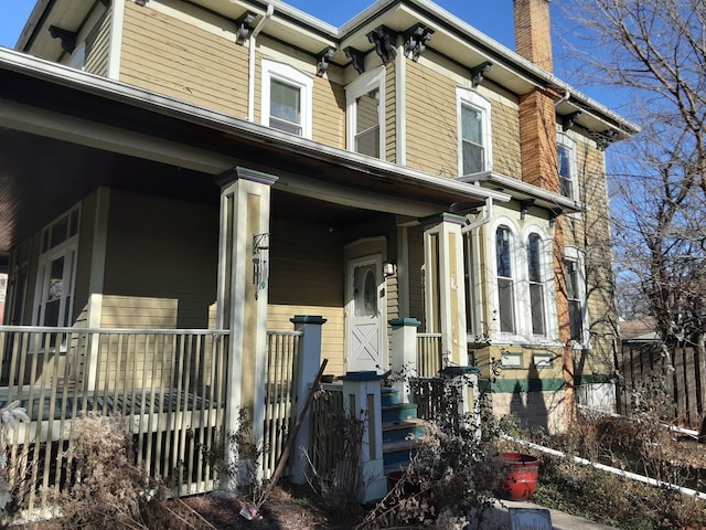 view of property exterior with covered porch