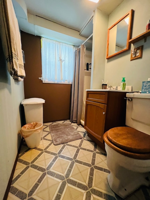 bathroom with vanity, tile flooring, and toilet