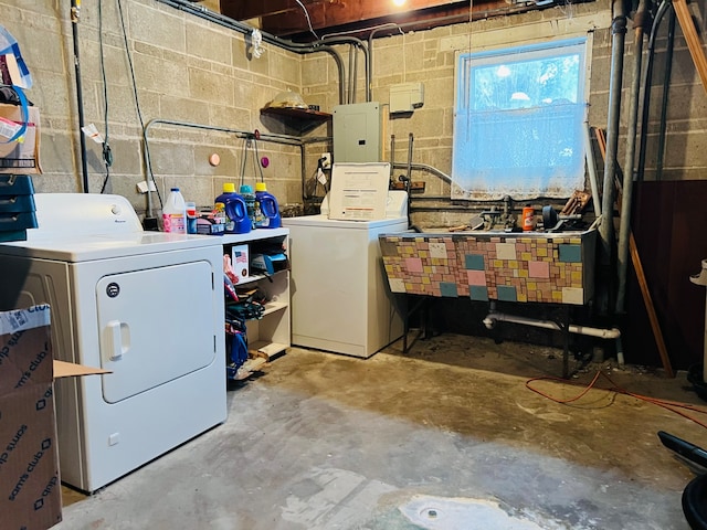 washroom with washing machine and clothes dryer