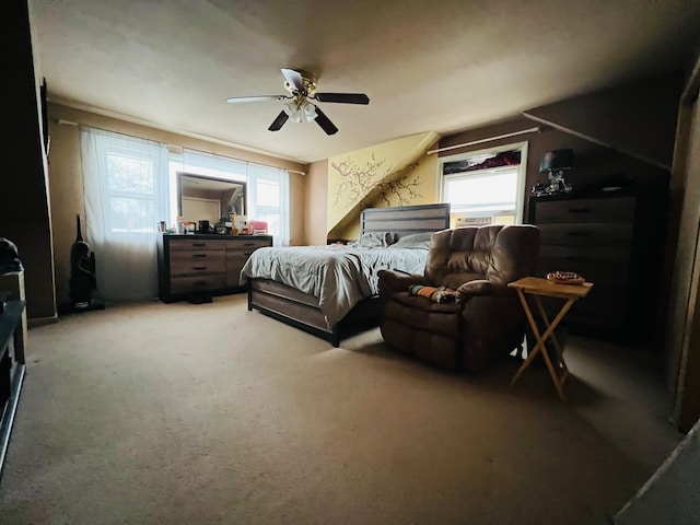 bedroom featuring multiple windows, carpet floors, and ceiling fan