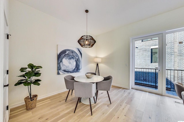 dining area with light hardwood / wood-style flooring