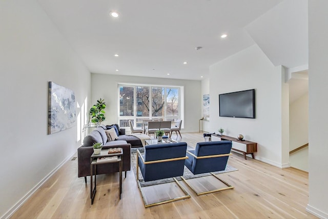 living room with light hardwood / wood-style flooring