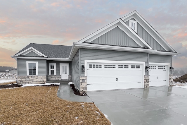 craftsman-style home with a garage