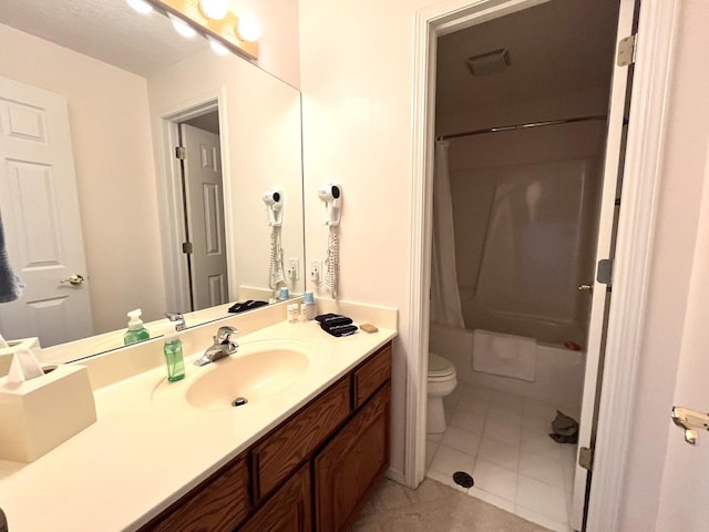full bathroom featuring tile patterned floors, vanity, toilet, and shower / bath combination with curtain