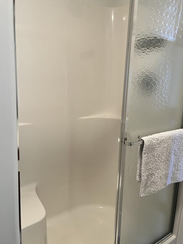 bathroom featuring a stall shower