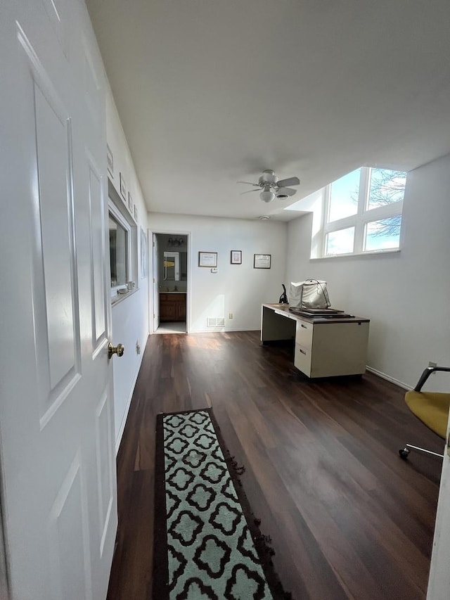 office with ceiling fan, visible vents, and dark wood finished floors