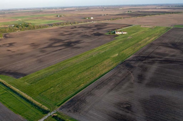 birds eye view of property featuring a rural view