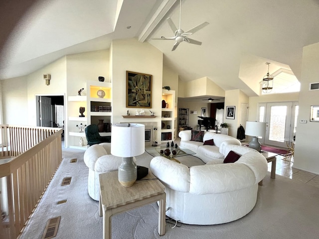 living room featuring built in features, high vaulted ceiling, ceiling fan, a fireplace, and beam ceiling