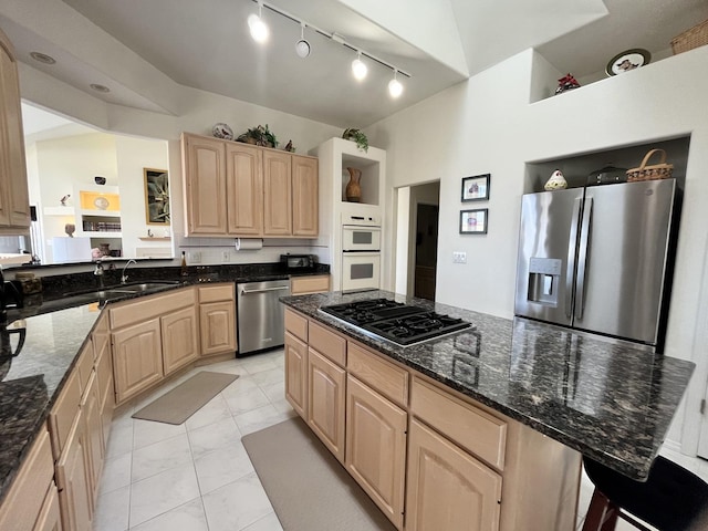 kitchen featuring a sink, track lighting, appliances with stainless steel finishes, and light brown cabinetry