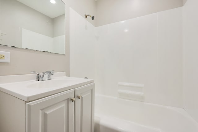 bathroom with vanity and  shower combination