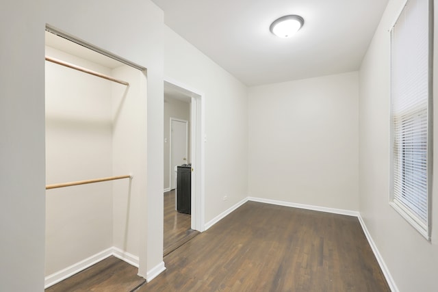 unfurnished room featuring dark hardwood / wood-style floors