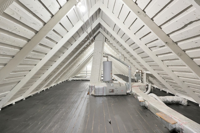 unfinished attic featuring water heater