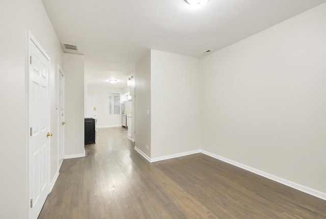 corridor with dark wood-type flooring