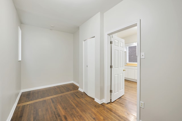 hall with dark hardwood / wood-style floors