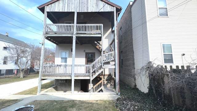 rear view of house featuring a balcony