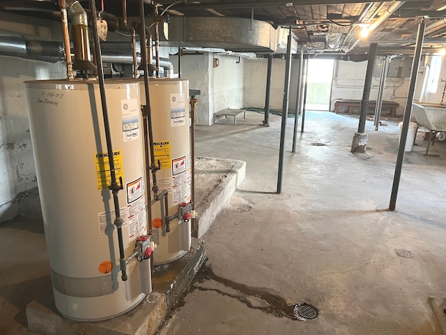 basement with water heater and sink