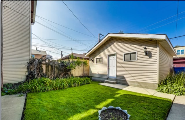 rear view of property with a lawn