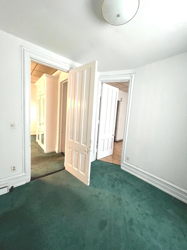 unfurnished bedroom featuring dark colored carpet