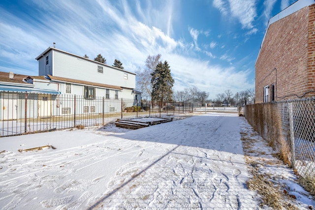 view of yard layered in snow