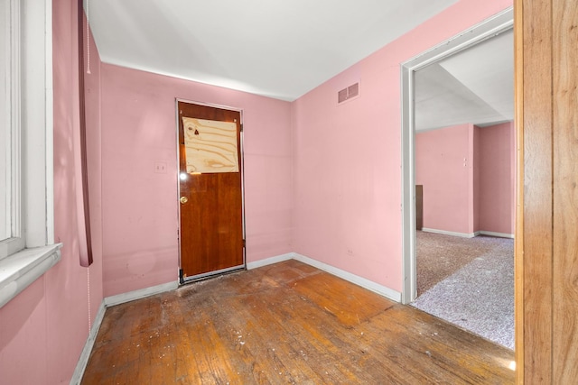 spare room with dark hardwood / wood-style floors