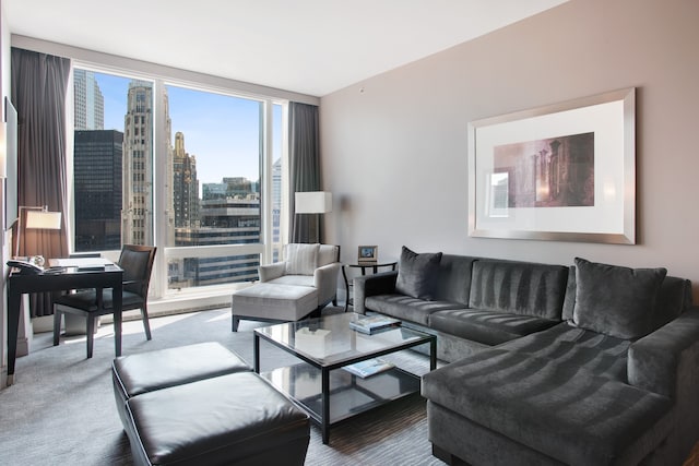 carpeted living room featuring floor to ceiling windows