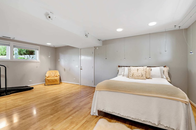 bedroom with wood-type flooring