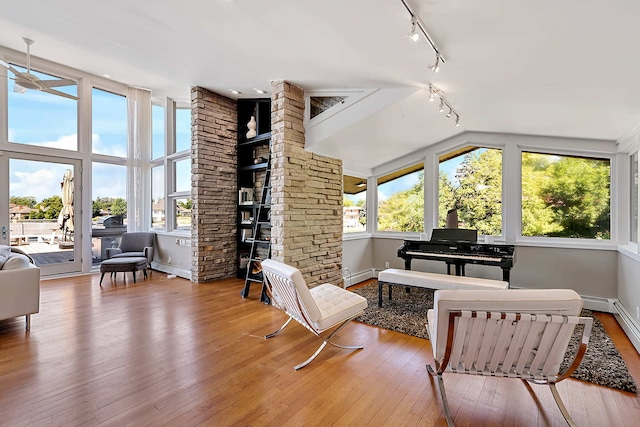 interior space with hardwood / wood-style floors and baseboard heating