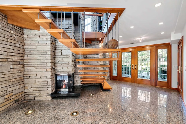 unfurnished living room featuring a wood stove