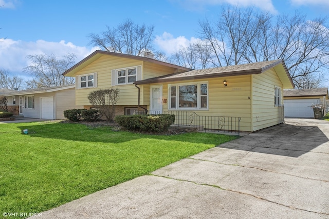 split level home featuring a front lawn and a garage