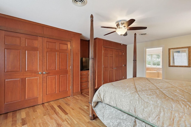 bedroom featuring ceiling fan, connected bathroom, and light hardwood / wood-style flooring