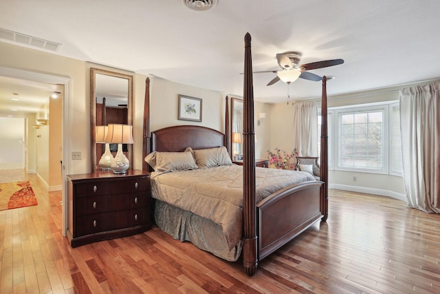 bedroom with ceiling fan and light hardwood / wood-style floors