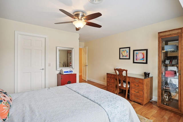 bedroom featuring ceiling fan and light hardwood / wood-style flooring