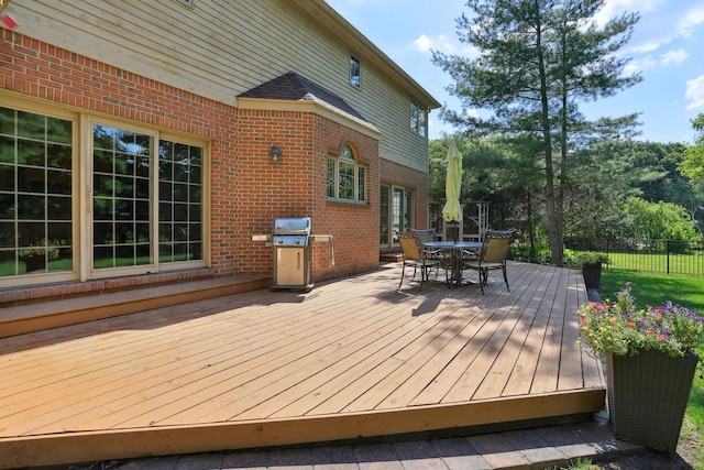 wooden terrace with area for grilling