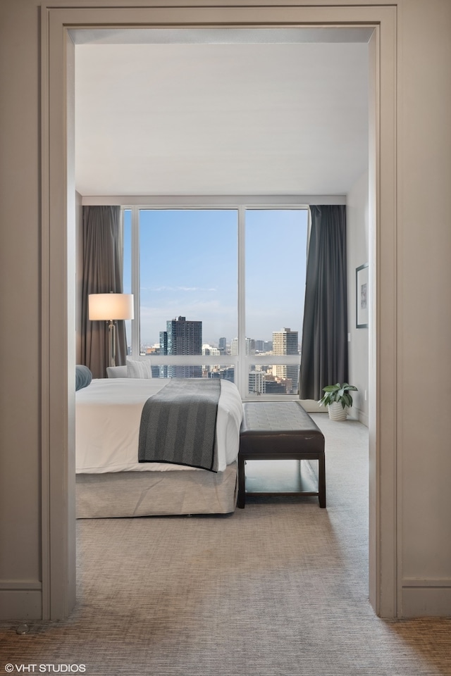 bedroom featuring light colored carpet