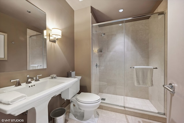 bathroom with walk in shower, tile floors, and toilet