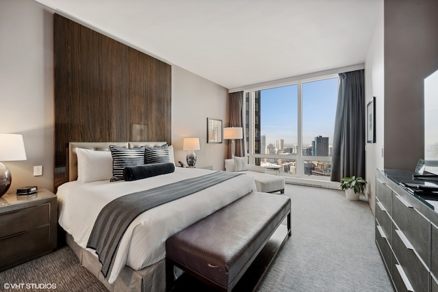 carpeted bedroom with wooden walls