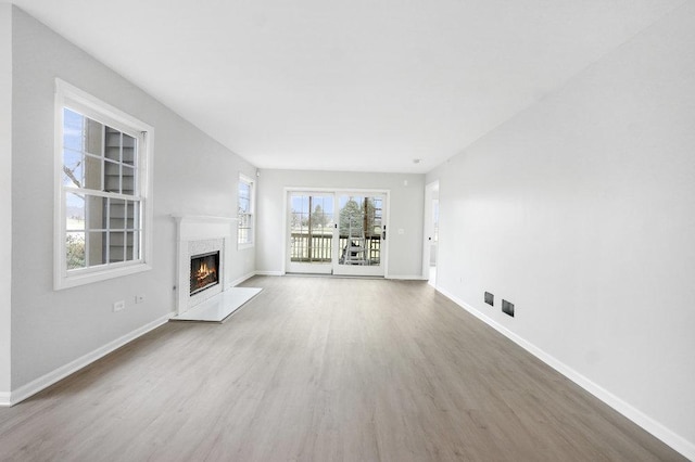 unfurnished living room featuring wood-type flooring