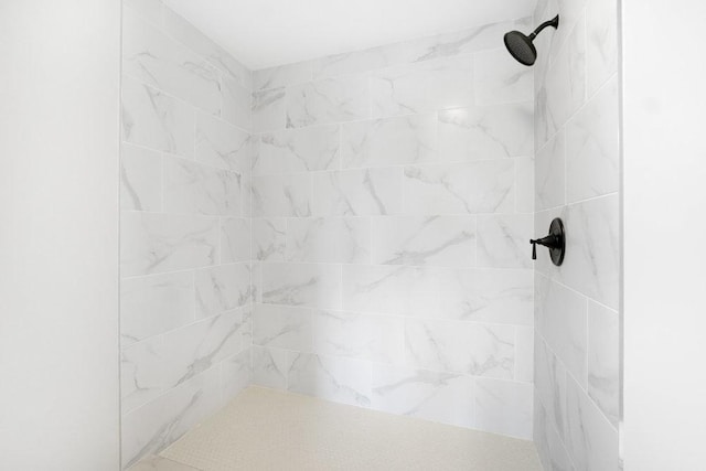 interior space featuring a tile shower