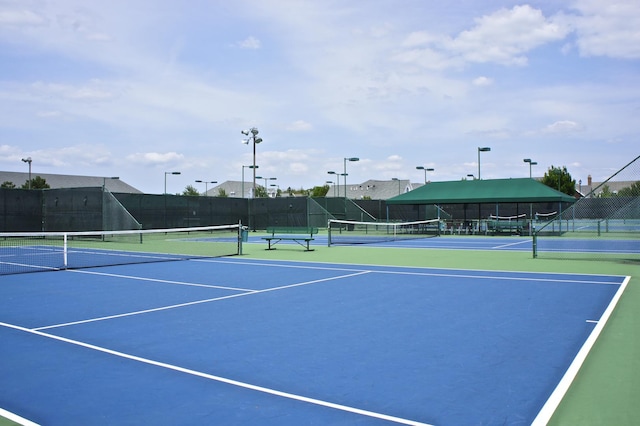 view of sport court with basketball hoop