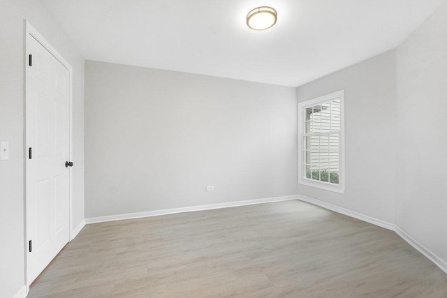 spare room with light wood-type flooring