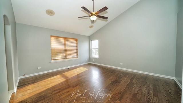 empty room featuring ceiling fan, dark hardwood / wood-style flooring, and high vaulted ceiling